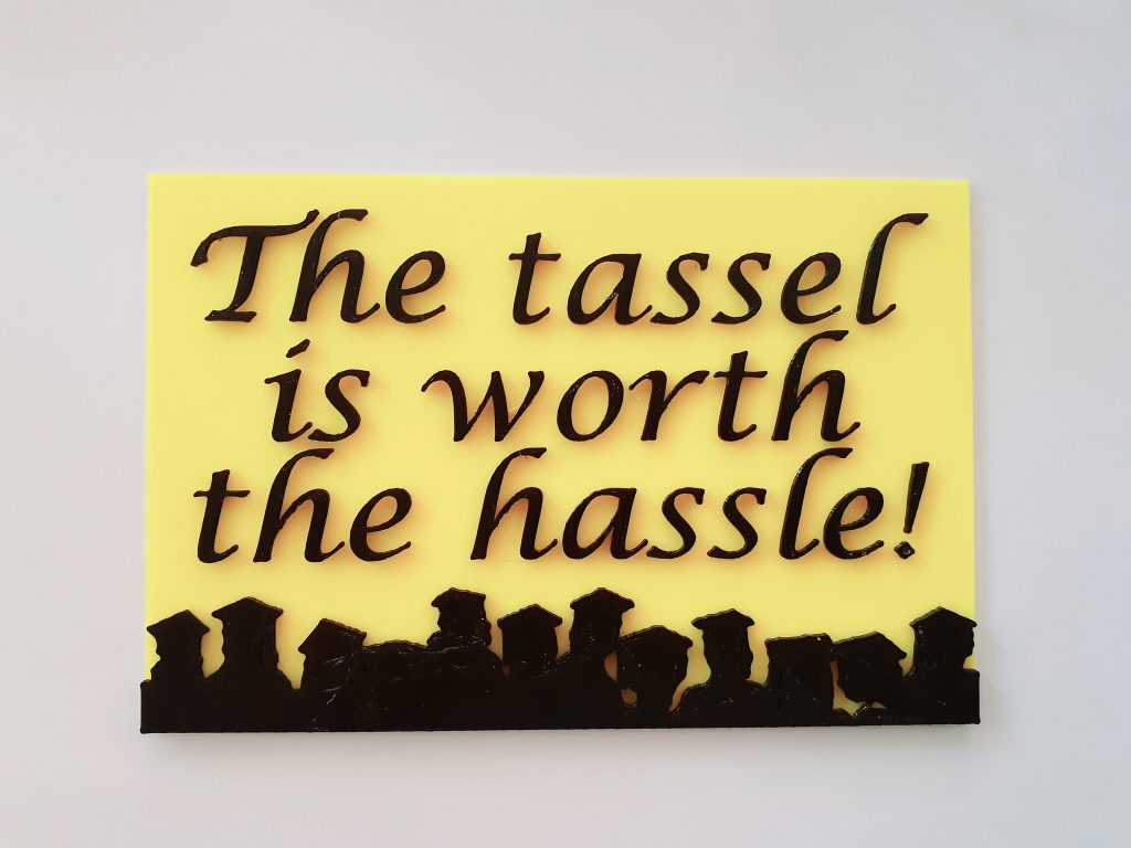 A sign that says "The tassel is worth the hassle!"